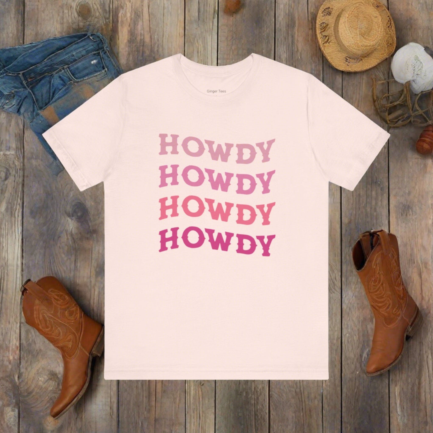 howdy cowgirl t-shirt with pink aesthetic western style fonts