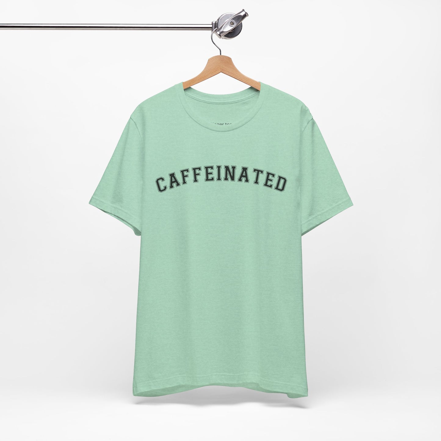 Heather Mint Caffeinated T-shirt featuring black 'college' style font, perfect for coffee lovers