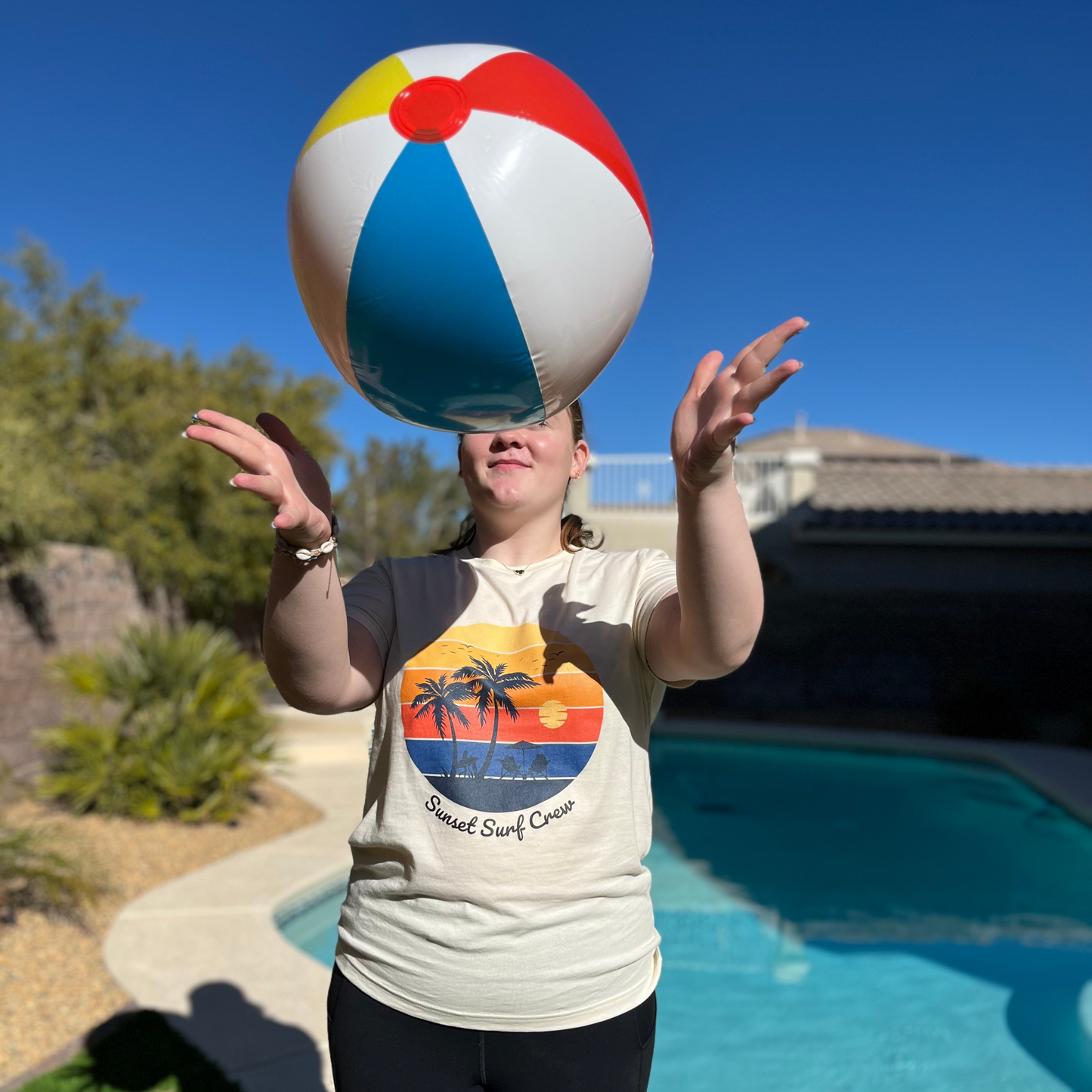 sunset surf crew tshirt, gradient sunset with beach palm trees. poolside with a beach ball, pool weather beach weather swimming