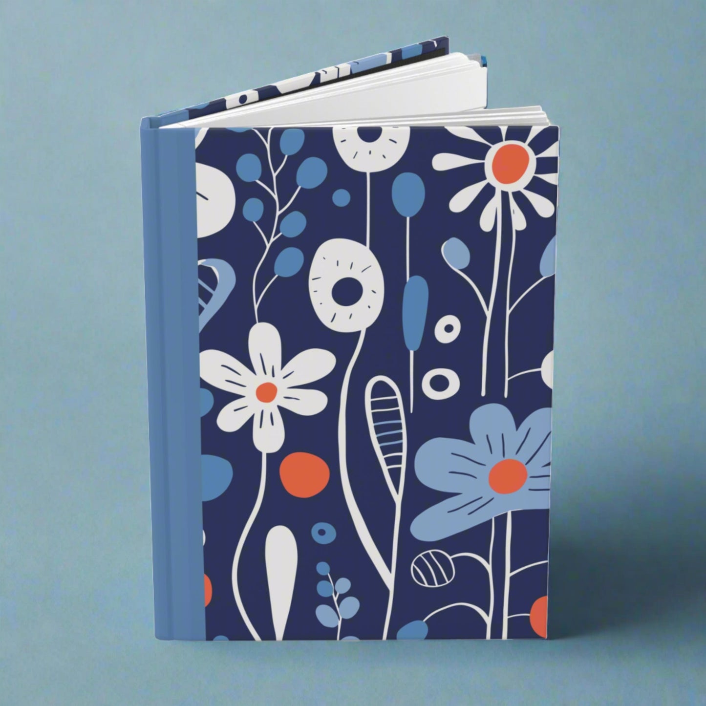 white blue and orange style flowers on a cute blue hardcover lined journal