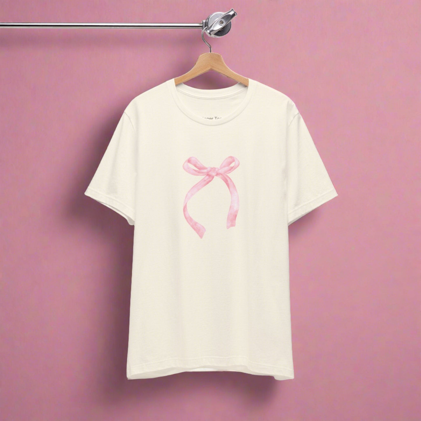 Feminine t-shirt featuring a charming pale pink bow accentuating the coquette style.
