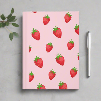 Adorable strawberry-patterned hardcover journal on pale pink background, softgirl aesthetic
