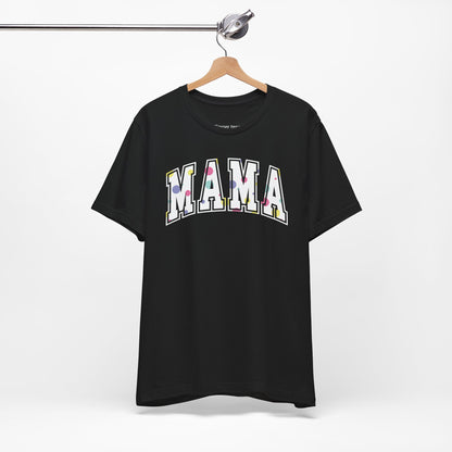 Charming Mother's Day t-shirt featuring 'Mama' in bold college-style typography with playful polka dot letters. Perfect for celebrating mom in style with a trendy and affectionate design.