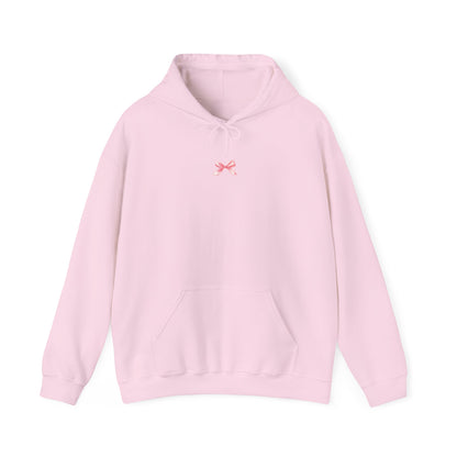 Trendy hooded sweatshirt with a coquette-inspired look, finished off with an adorable pink bow.