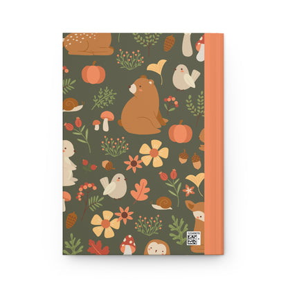 journal cover featuring adorable illustrations of forest animals like squirrels, foxes, and owls, surrounded by trees and mushrooms in a playful, colorful design.