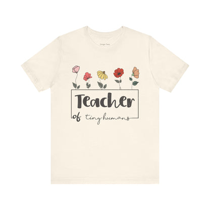 Show off your nurturing spirit with this cute t-shirt, decorated with charming floral motifs, ideal for teachers of tiny humans.