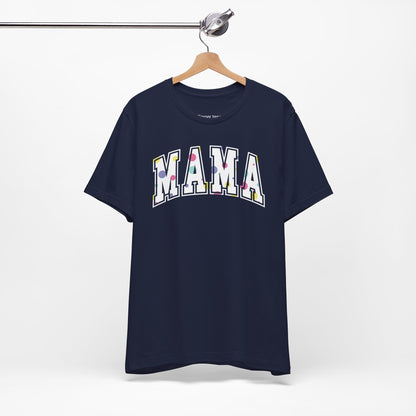 Charming Mother's Day t-shirt featuring 'Mama' in bold college-style typography with playful polka dot letters. Perfect for celebrating mom in style with a trendy and affectionate design.