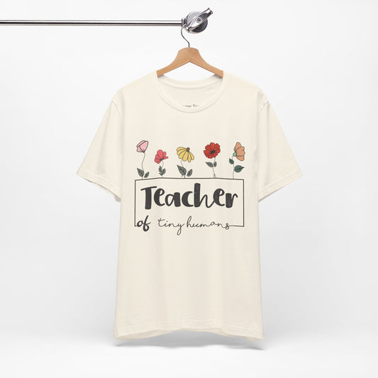 Adorable t-shirt for teachers of tiny humans, adorned with delicate floral patterns